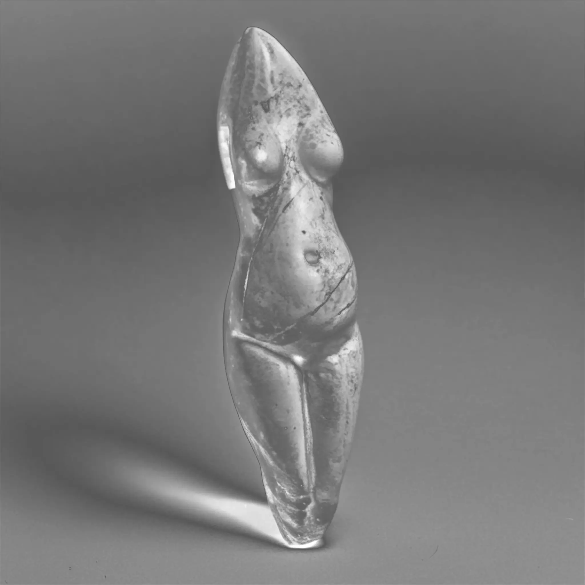 A venus figurine of a woman's body generated with custom AI in black and white. It has no head and no arms.